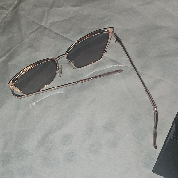 Stylish Pink and Black Sunglasses for a Bold Look - Picture 13 of 16